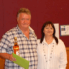 Retired Rep Brian Roberts being presented with a leaving gift by Joy Thompson