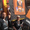 Karen and Kaveh Damestani with the branch banner