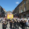 Leyburn Brass Band leading the GMB banners